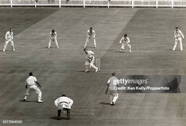 England batsman Doug Insole plays a delivery from West Indies bowler Roy Gilchrist during the 1st Test match between England and West Indies at...