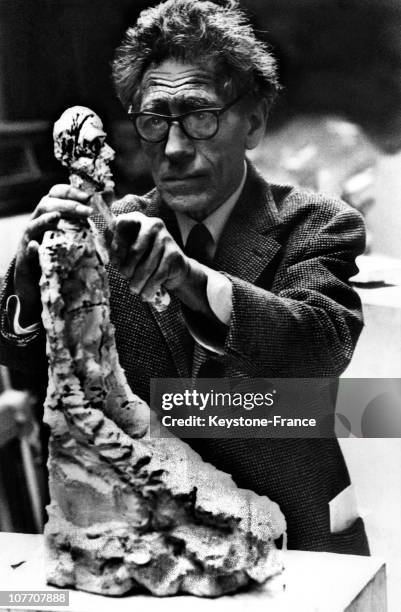 Portrait On July 18, 1965 Of The Sculptor Alberto Giacometti Finishing Up One Of His Works, One Of His Lanky Figures, For An Exhibition At The Tate...