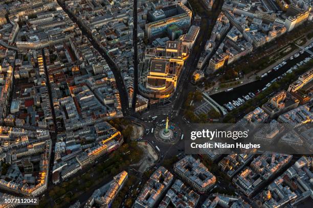 aerial flying over la bastille in paris france, sunset - opera della bastiglia foto e immagini stock