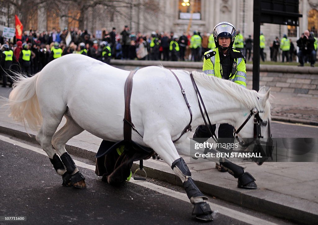 A police officer struggles to control he