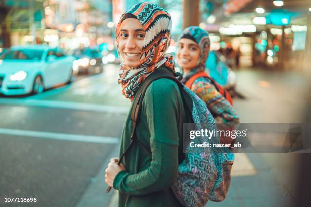 two muslim girls travelling. - auckland city people stock pictures, royalty-free photos & images