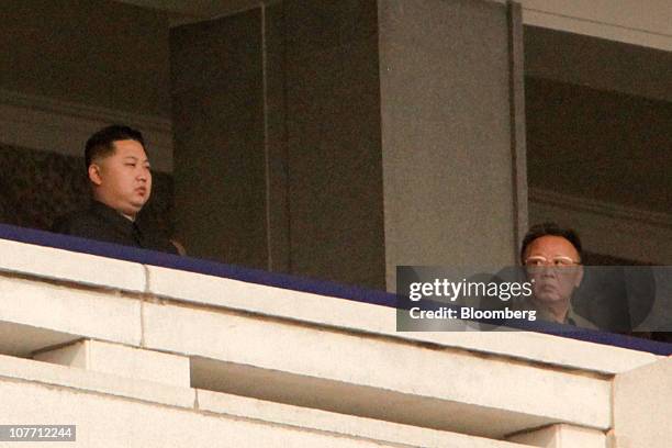 Kim Jong Il, leader of North Korea looks towards his son Kim Jong Un, during a military parade commemorating the 65th anniversary of founding of the...