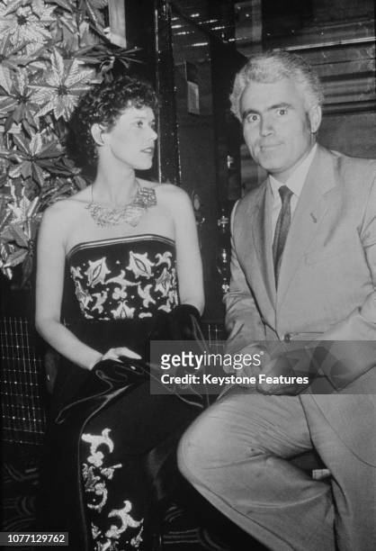 Dutch model and actress Sylvia Kristel with French film director Just Jaeckin, at a soirée at Regine's nightclub in Paris, France, in honour of...