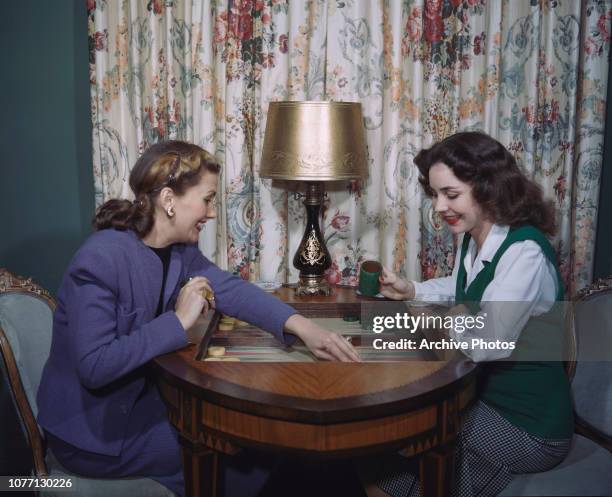 American actress Jennifer Jones playing backgammon, circa 1950.