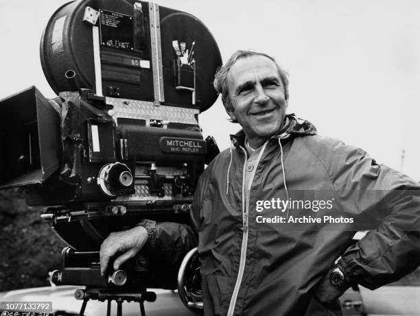 American film director Richard Fleischer with a Mitchell BNC Reflex camera on the set of the Columbia Pictures film '10 Rillington Place', 1971....
