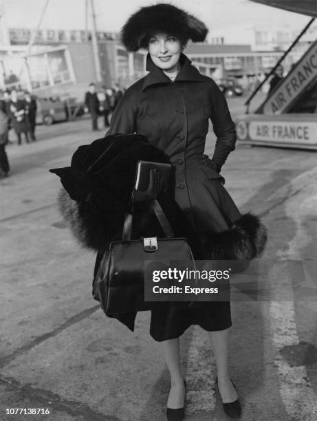 American actress Arlene Dahl arrives at London Airport to work on a new movie, 24th November 1955.