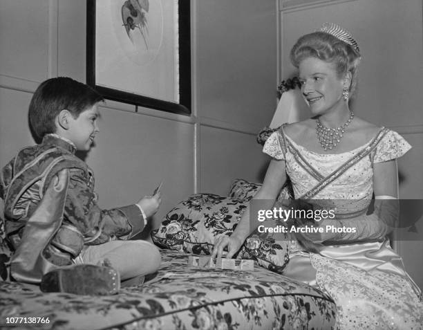 Co-stars Tommy Rettig and Ann Harding playing canasta on the set of the MGM film 'The Tender Hours', aka 'Two Weeks with Love', 1950. They are in...