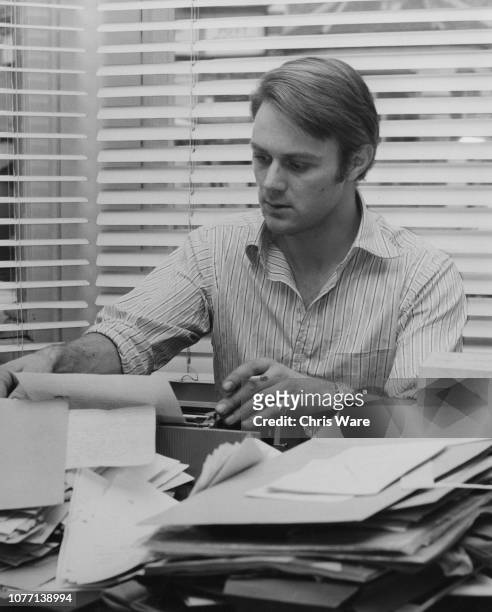 English actor Christopher Cazenove working at his house in Battersea, London, March 1972. He stars in the popular BBC television series 'The...