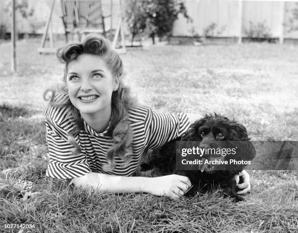 American singer and actress Julie London with Rory Calhoun's dog Roxanne, 1946. Julie and Rory will be starring together in the 1947 film 'The Red...