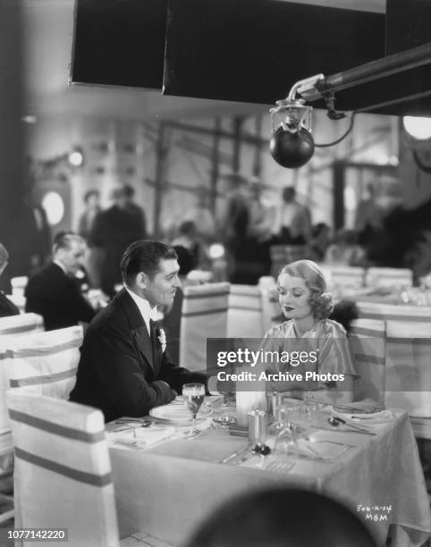 Actors Clark Gable and Constance Bennett film a scene for the MGM production 'After Office Hours', 13th December 1934.