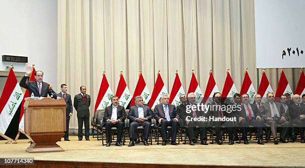 This handout image provided by the Iraqi Prime Minister Office shows Iraqi Prime Minister Nuri al-Maliki and members of his newly-formed cabinet...