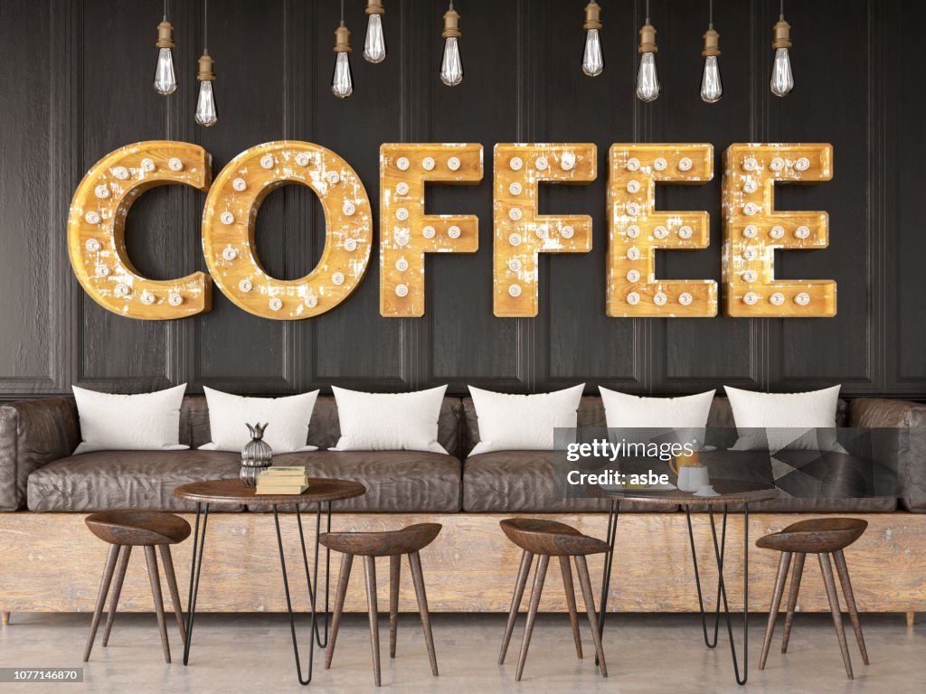 Signo de cafetería bombilla de luz en pared de ladrillo negro