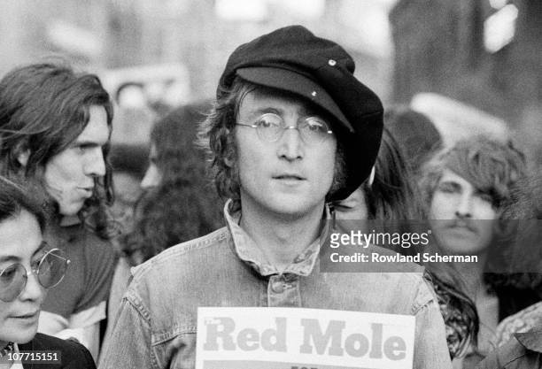 Portrait of British musician John Lennon and his wife, artist and musician Yoko Ono as they attend an unspecified rally in Hyde Park, London,...