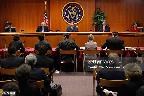 Federal Communications Commission Commissioners Mignon Clyburn, Michael Copps, Chairman Julius Genachowski, Robert McDowell and Meredith Attwell...