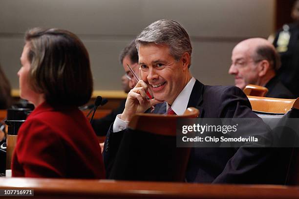 Federal Communications Commission Commissioner Robert McDowell listens to fellow commissioner Meredith Attwell Baker deliver remarks before the...