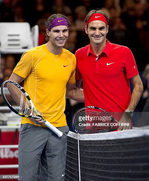 Spain's Rafael Nadal poses with Switzerland's Roger Federer prior to their charity game on December 21, 2010 in Zurich. "The Match for Africa" was...