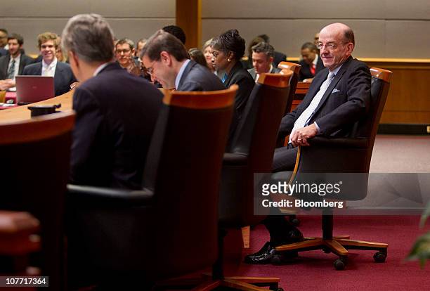 Michael Copps, commissioner of the U.S. Federal Communications Commission, right, listens as Julius Genachowski, chairman of the FCC, second from...