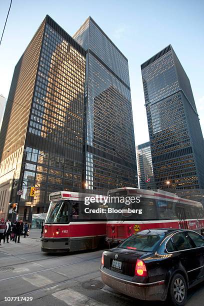 Traffic passes by the headquarters building of Toronto-Dominion Bank in Toronto, Ontario, Canada, on Tuesday, Dec. 21, 2010. Toronto-Dominion Bank...