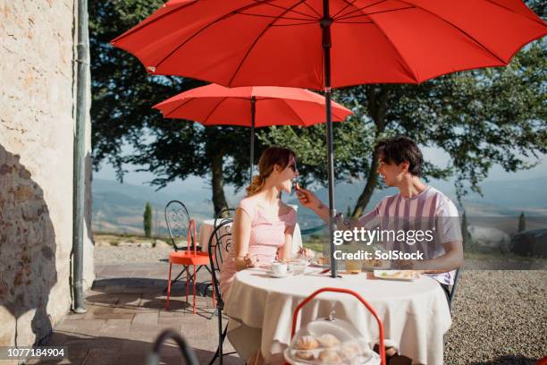 couple eating breakfast in italy - italian villa stock pictures, royalty-free photos & images