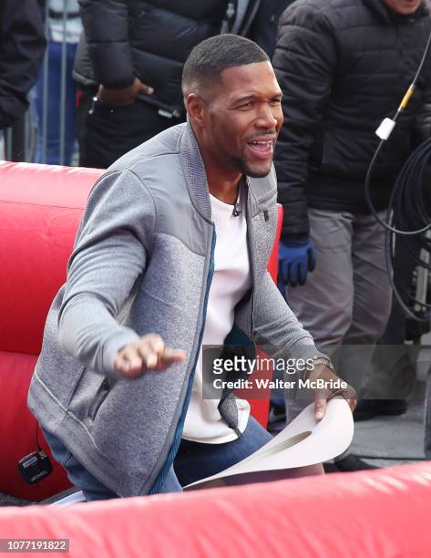 Michael Strahan riding a Mechanical Bull during a Good Morning America filming promoting PBR: Unleash the Beast in Times Square on January 4, 2019 in...
