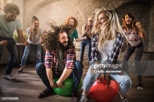 space hopper game at casual office! - balls bouncing stock pictures, royalty-free photos & images