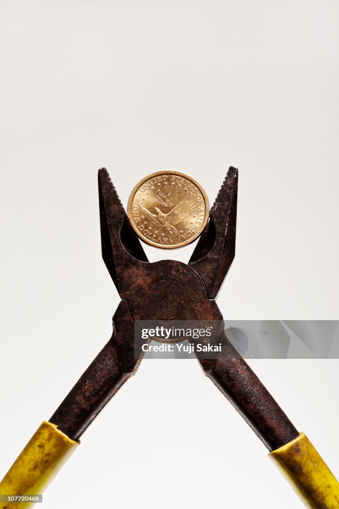 Pliers and coins