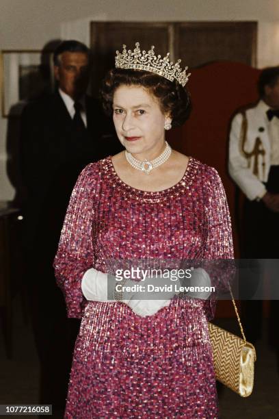 Queen Elizabeth II wears a four strand diamond and pearl choker with 'Granny's Tiara' to a banquet in Bangladesh, 16th November 1983.