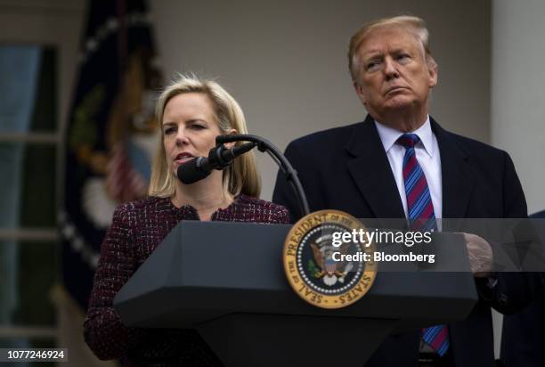 Kirstjen Nielsen, U.S. Secretary of Homeland Security , speaks while U.S. President Donald Trump, right, listens during a news conference in the Rose...