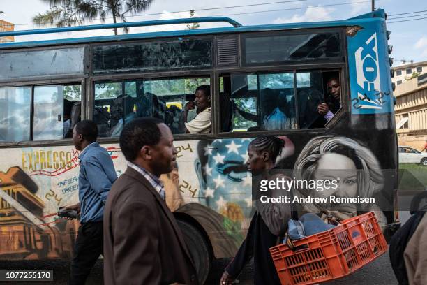 Matatu, with a mural of the American television drama passes a bus stop on December 04, 2018 in Nairobi, Kenya. The private minibuses were to have...