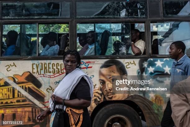 Matatu, with a mural of the American television drama passes a bus stop on December 04, 2018 in Nairobi, Kenya. The private minibuses were to have...