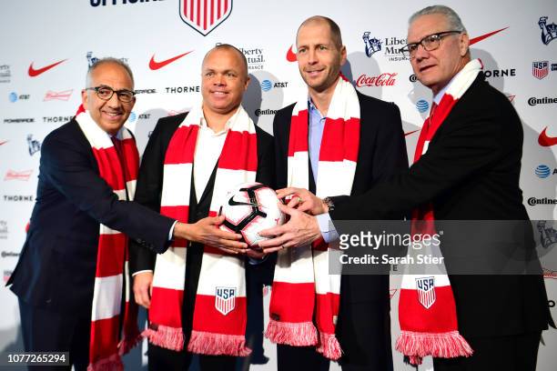 President Carlos Cordeiro, National Team General Manager Earnie Stewart, Head Coach Gregg Berhalter, and CEO Dan Flynn pose for a photo after a press...