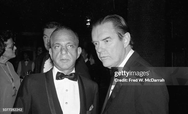 View of American attorneys and law partners Roy Cohn and Tom Bolan during Cohn's birthday party at the Seventh Regiment Armory , New York, New York,...