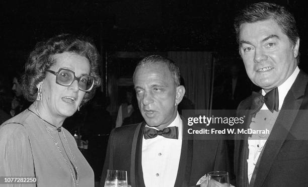 American attorney Roy Cohn poses with an unidentified woman and man during Cohn's birthday party at the Seventh Regiment Armory , New York, New York,...