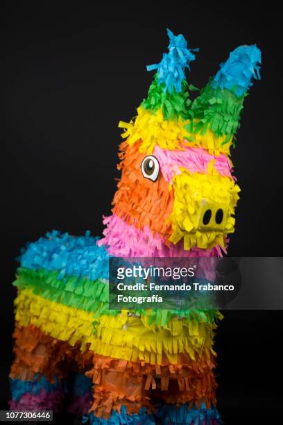 donkey-shaped pinata colors - piñata stock-fotos und bilder