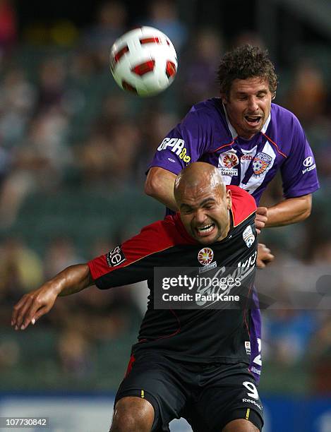 Josh Mitchell of the Glory and Sergio Van Dijk of Adelaide contest the ball during the round 19 A-League match between the Perth Glory and Adelaide...