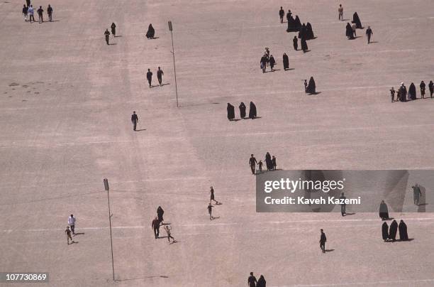 Thousands of people mourn the passing away of Ayatollah Khomeini near Behesht Zahra cemetery, 6th June 1989.