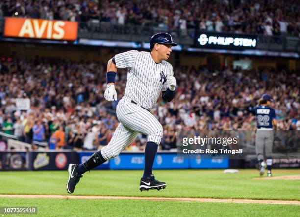 Alex Rodriguez of the New York Yankees runs the bases after hitting a double in the first inning during a game against the Tampa Bay Rays at Yankee...