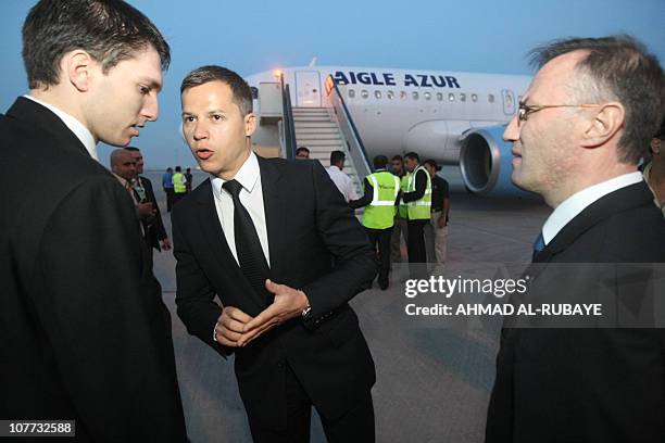 French ambassador to Iraq Boris Boillon waits for France's Trade Minister Anne-Marie Idrac and 111 passengers to disembark from an Airbus A319 plane...