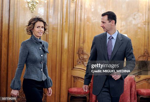 Syrian president Bashar al-Assad and his wife Asma arrive to deliver a speech for the Syrian Community on December 9, 2010 in Paris. Al-Assad is on a...