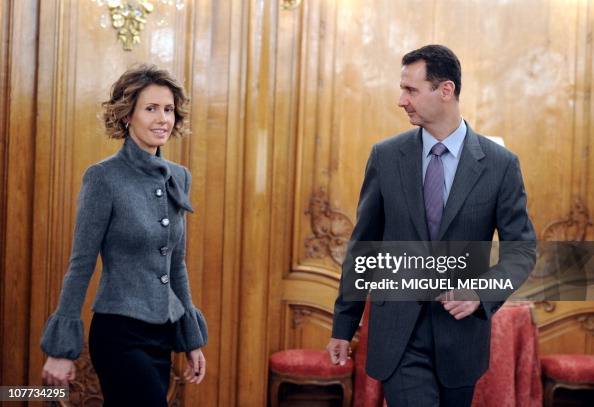 Syrian president Bashar al-Assad and his wife Asma arrive to deliver ...