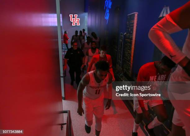 Houston Cougars guard Nate Hinton and teammates enter the tunnel on their way to the locker room at half time of the basketball game between the...