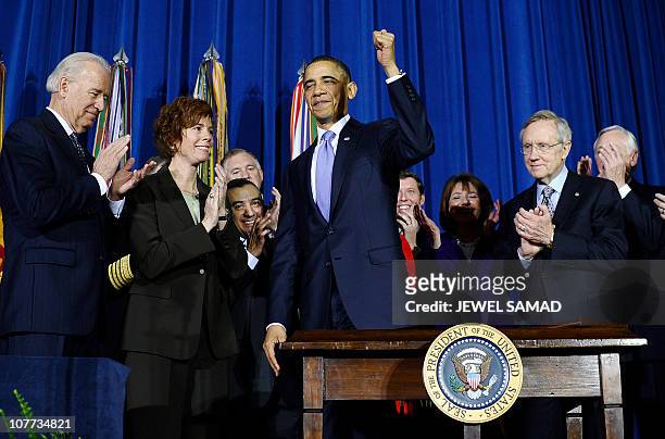 President Barack Obama gestures after signing the Don't Ask, Don't Tell Repeal Act of 2010 into law at the Department of the Interior in Washington,...