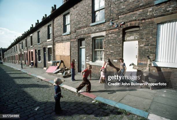 Children playing on a terraced street in Manchester, England in 1976.