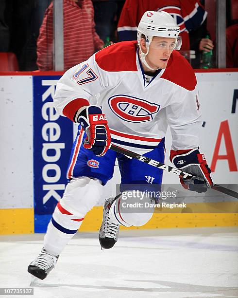 Dustin Boyd of the Montreal Canadiens skates around in warm-ups before an NHL game against the Detroit Red Wings at Joe Louis Arena on December 10,...