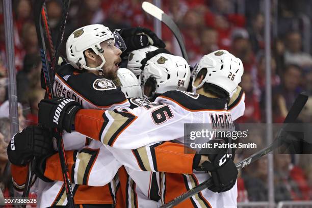 Pontus Aberg of the Anaheim Ducks is mobbed by teammates after scoring the game-winning goal against the Washington Capitals during the third period...