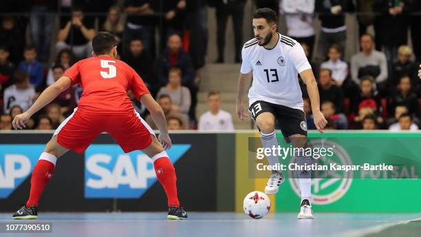 Muhammet Soezer of Germany challenges Luiz Felipe Farias of Switzerland during the Futsal match between Germany and Switzerland on December 3, 2018...