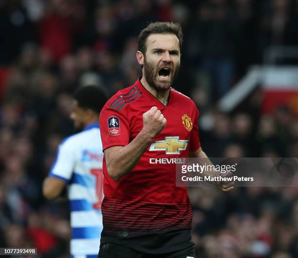 Juan Mata of Manchester United celebrates scoring their first goal during the FA Cup Third Round match between Manchester United and Reading at Old...
