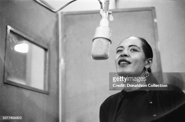 Singer Billie Holiday records her penultimate album 'Lady in Satin' at the Columbia Records studio in December 1957 in New York City, New York.