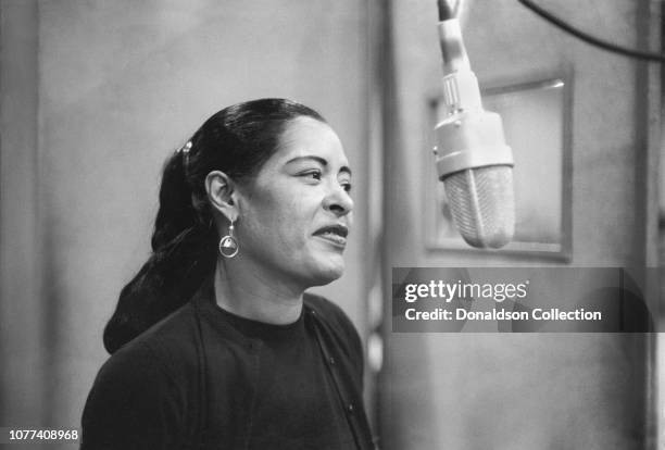 Singer Billie Holiday records her penultimate album 'Lady in Satin' at the Columbia Records studio in December 1957 in New York City, New York.