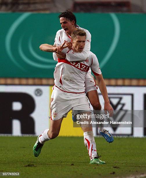 Pavel Pogrebnyak of Stuttgart celebrates scoring his second team goal with his team mate Martin Harnik during the DFB Cup last 16 match between VfB...